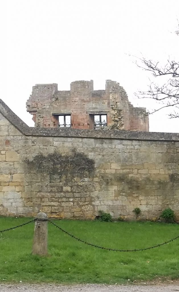 Behind the wall can be seen the fire reddened ruin of the Banqueting House of Campden House, Chipping Campden